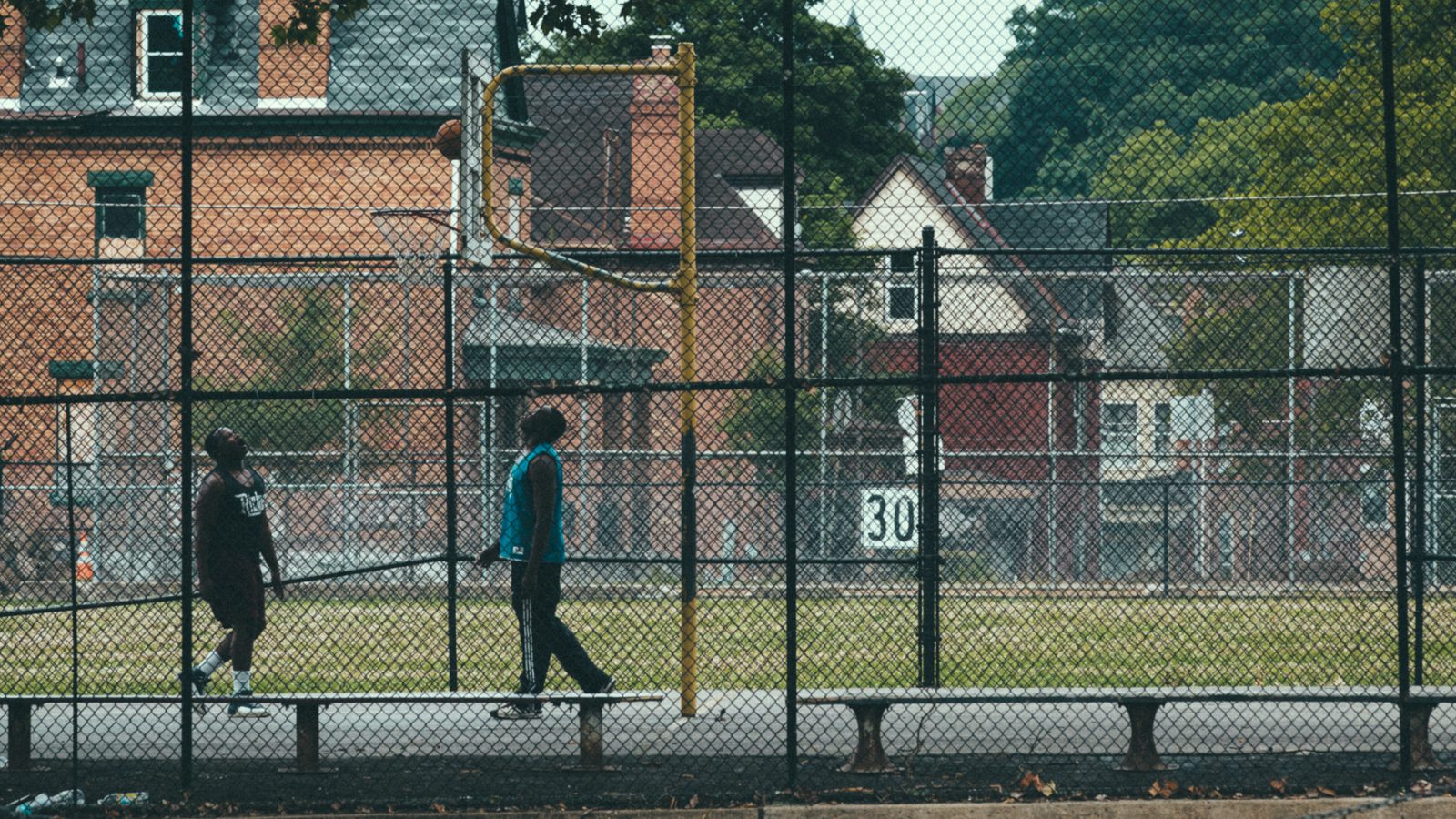 two guys playing basketball