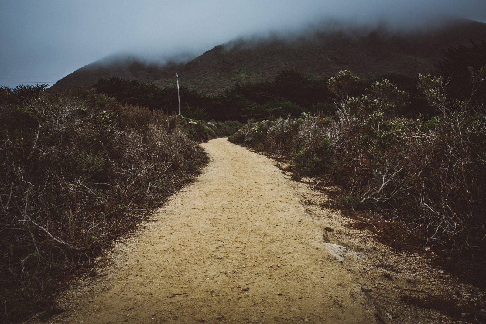 dirt path with sky in background