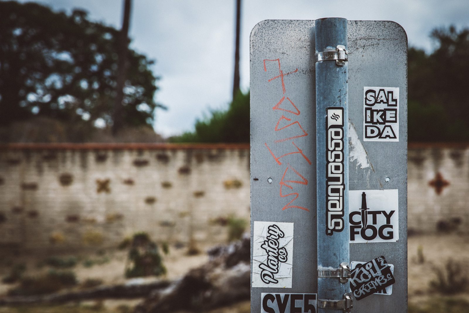 cool sign on the beach with stickers