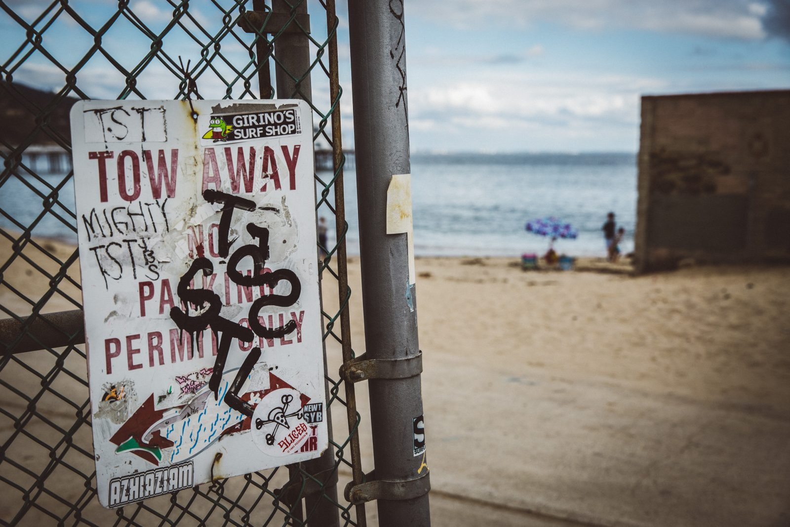 Graffiti on the fence by the beach